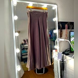 Size medium long tan skirt matches so much